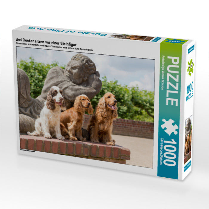 trois cockers assis devant une figure de pierre - puzzle photo CALVENDO 