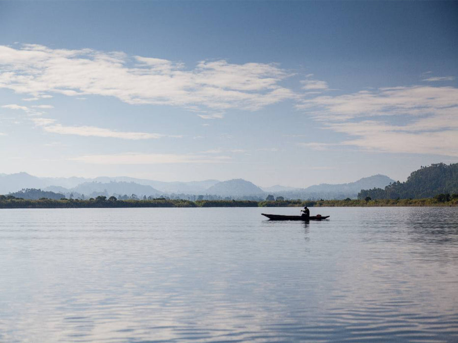 Kanu am Morgen auf dem Lake Mutanda - CALVENDO Foto-Puzzle'