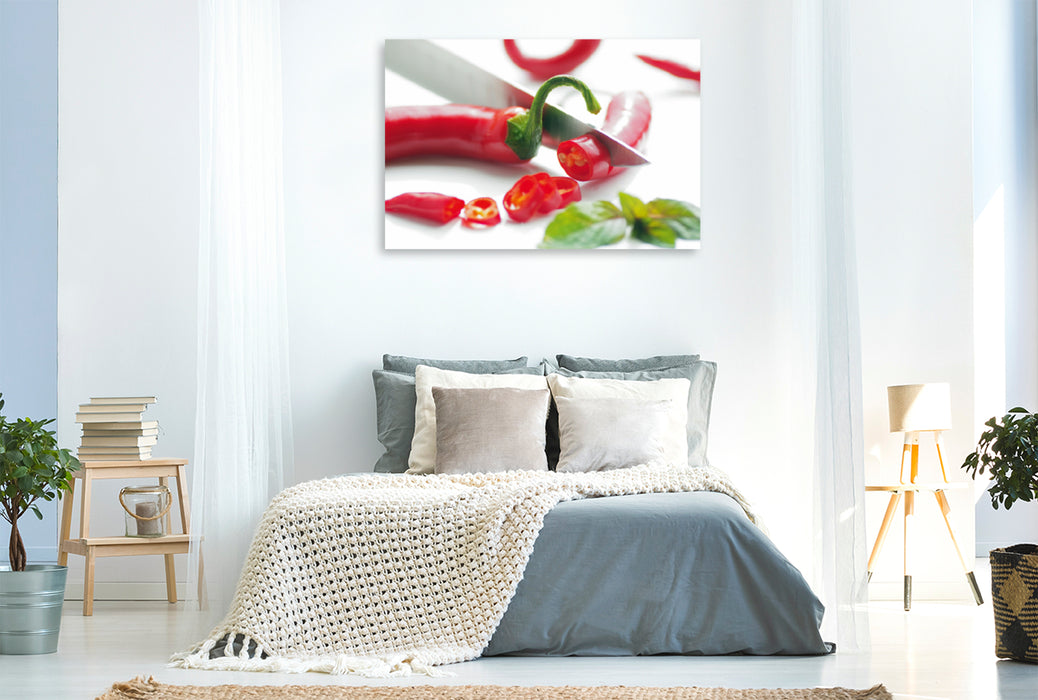 Premium Textil-Leinwand Premium Textil-Leinwand 120 cm x 80 cm quer Rote Chili im Kontrast mit Kräutern