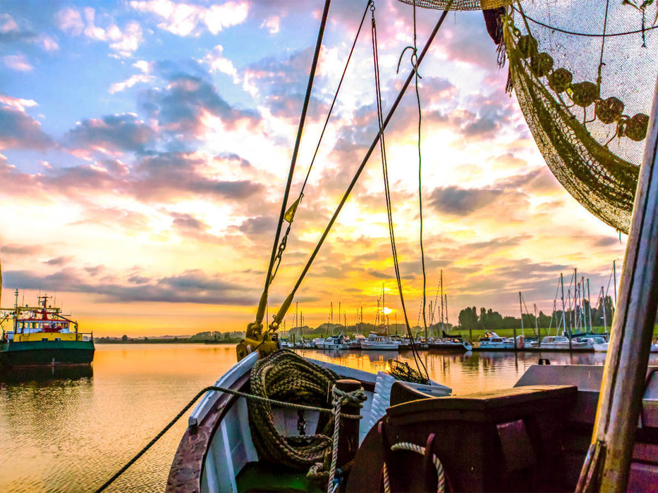 Blick durch ein Boot zum Sonnenaufgang - CALVENDO Foto-Puzzle'