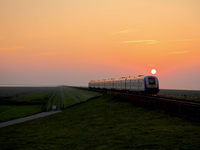 Die Nordostseebahn im Sonnenuntergang 1000 Teile Puzzle quer - CALVENDO Foto-Puzzle'