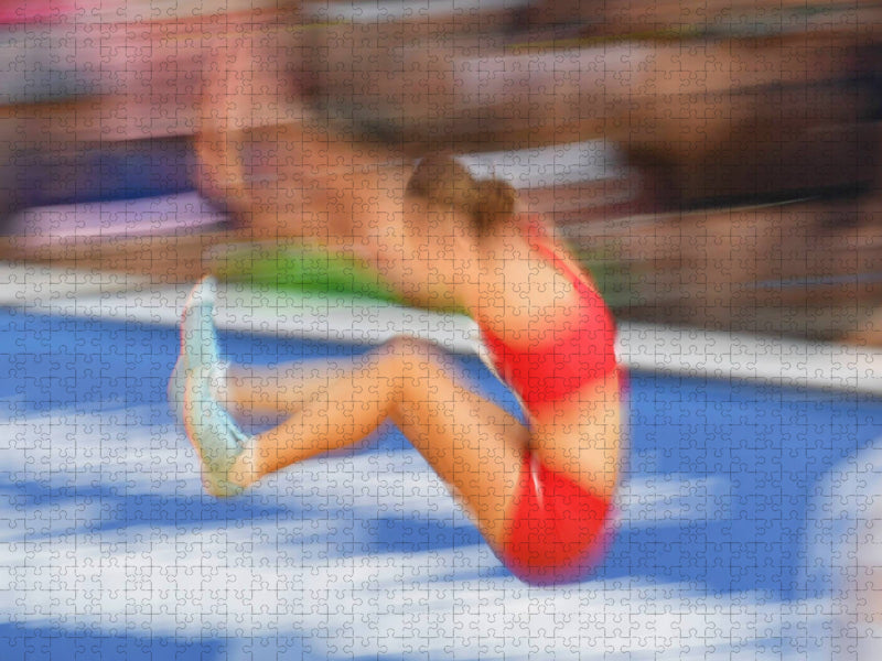 Leichtathletik Wettkampf: Momentaufnahme aus dem Weitsprung - CALVENDO Foto-Puzzle'