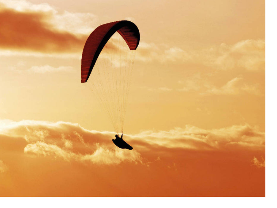 Paragliding im warmen Licht der untergehenden Sonne. - CALVENDO Foto-Puzzle'