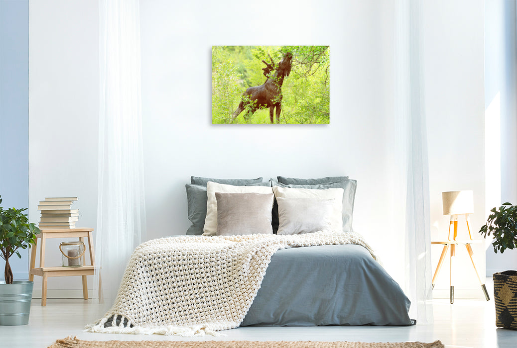 Premium textile canvas moose in the middle of fresh, green tree shoots 