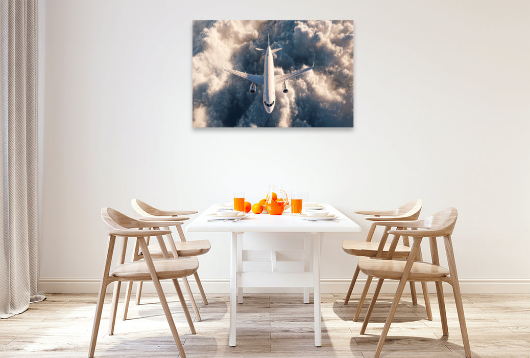 Premium Textil-Leinwand Flugzeug über den Wolken im Gegenlicht