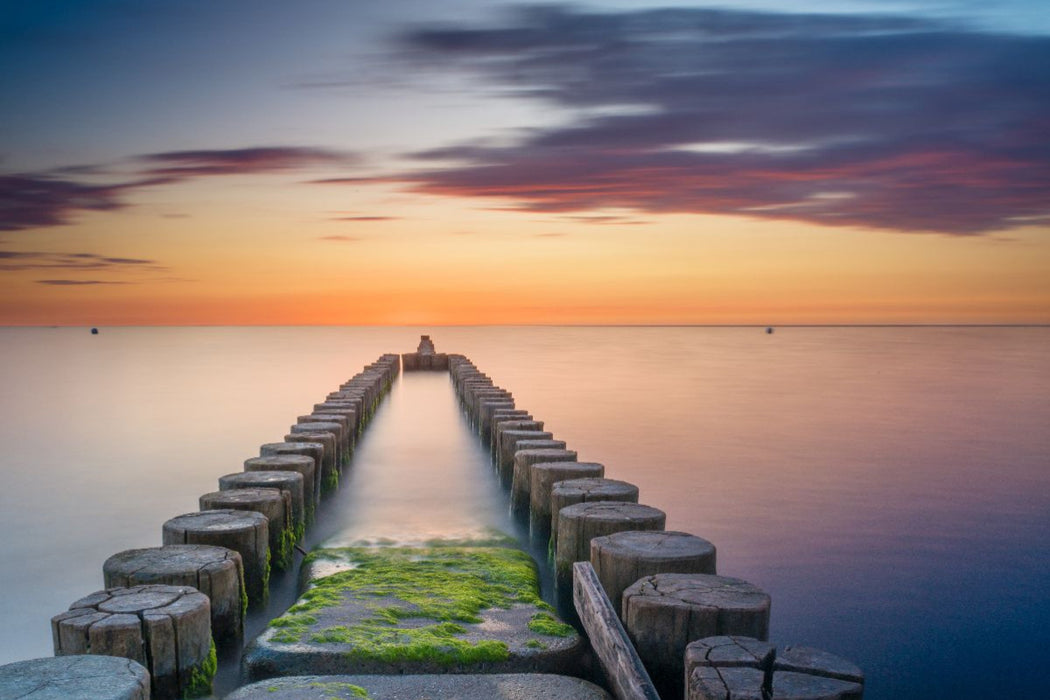 Premium Textil-Leinwand Buhnen beim Sonnenuntergang über der Ostsee