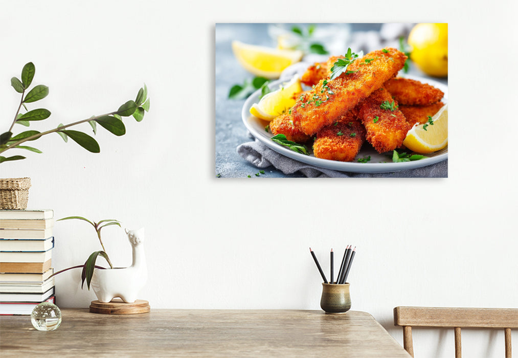 Premium Textil-Leinwand Knusprige Fischstäbchen mit frischer Zitrone