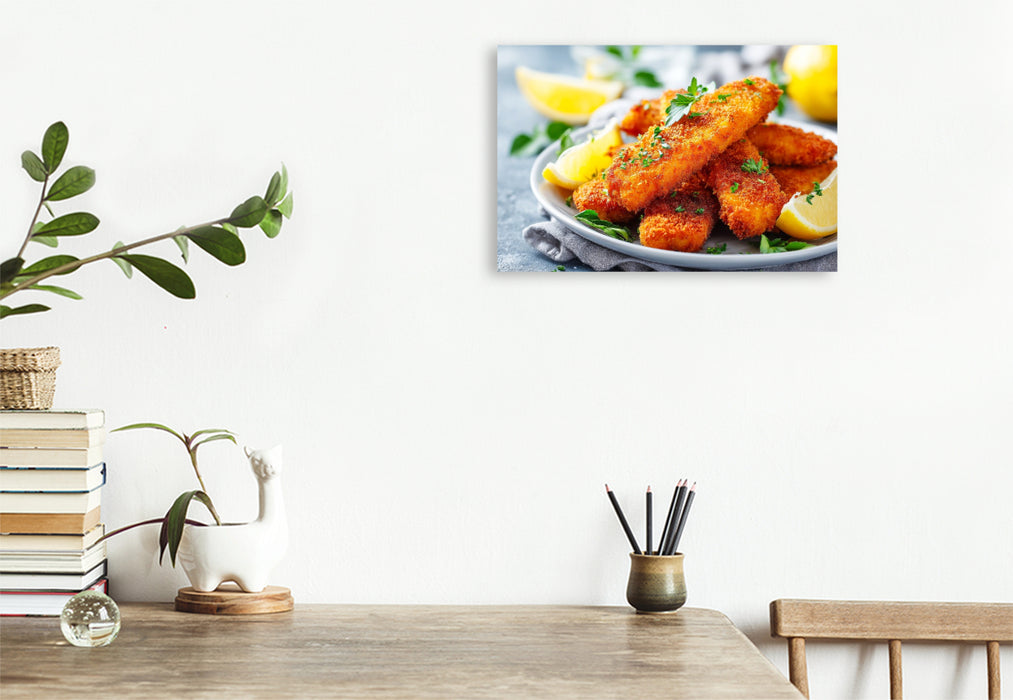 Premium Textil-Leinwand Knusprige Fischstäbchen mit frischer Zitrone