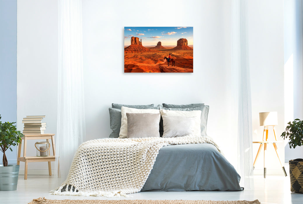 Premium Textil-Leinwand Monument Valley – Im Land der roten Riesen. Ein Cowboyblick über die Weiten des Wilden Westens