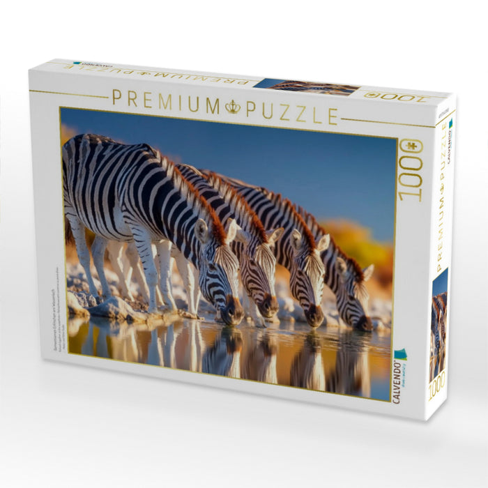 Gemeinsames Erfrischen am Wasserloch - CALVENDO Foto-Puzzle'