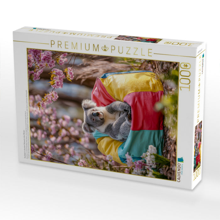 Koalabär im bunten Sitzsack unter Blüten - CALVENDO Foto-Puzzle'