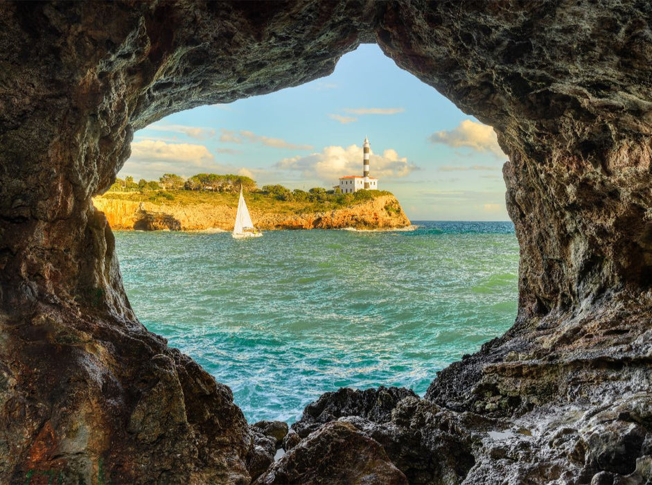 Blick durch einen Felsbogen in Portocolom auf Mallorca - CALVENDO Foto-Puzzle'