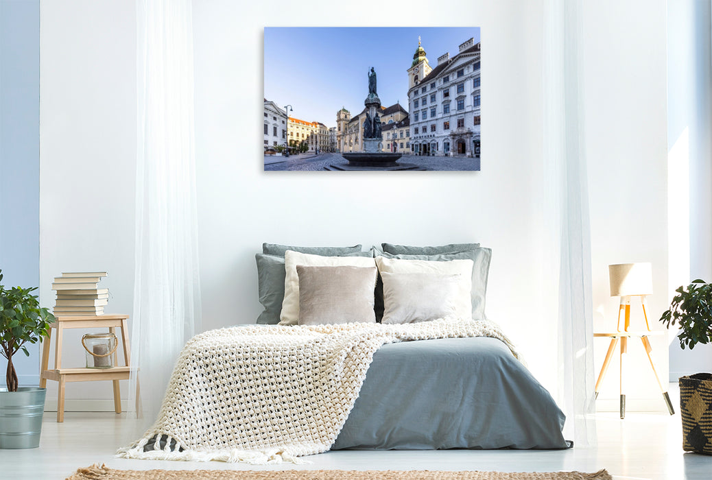 Premium Textil-Leinwand Austriabrunnen und Schottenkirche auf dem Platz Freyung in Wien