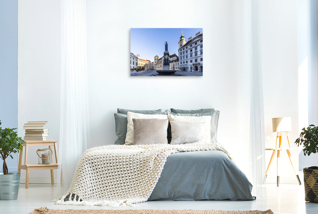 Premium Textil-Leinwand Austriabrunnen und Schottenkirche auf dem Platz Freyung in Wien
