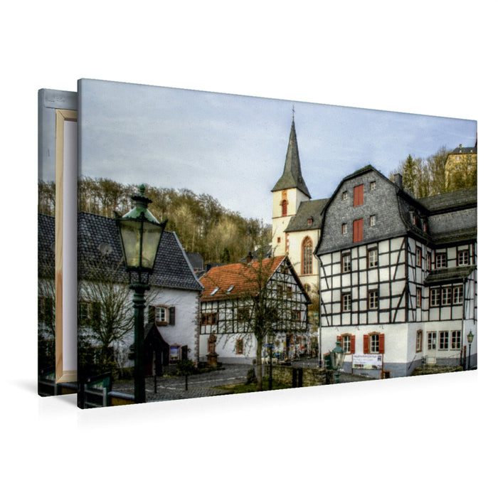 Premium Textil-Leinwand Premium Textil-Leinwand 120 cm x 80 cm quer Blick auf das Rathaus und Kirche in Blankenheim