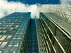 Spiegelnde Glassfassaden eines Hochhauses mit Himmelsblick - CALVENDO Foto-Puzzle - calvendoverlag 39.99