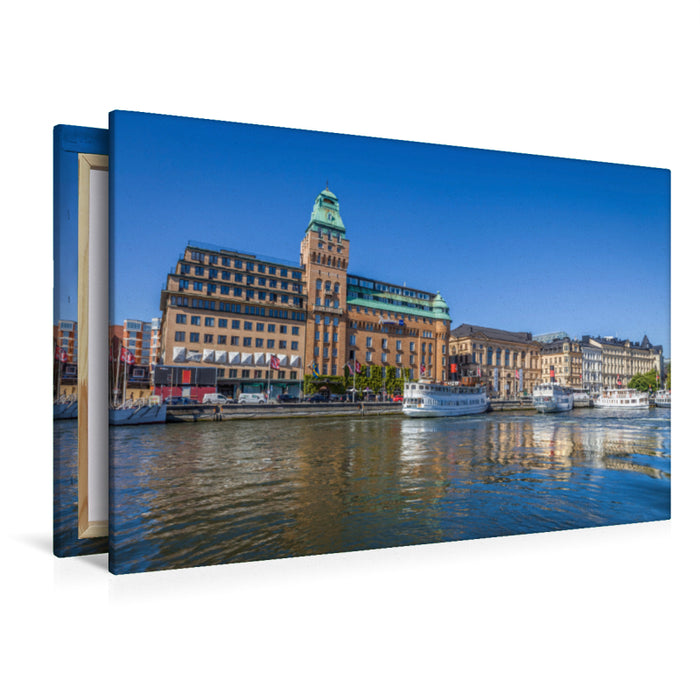 Premium textile canvas Premium textile canvas 120 cm x 80 cm landscape harbor of Stockholm with historic hotel and ferry boats 