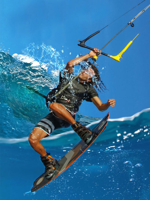 Un kite surfeur se bat avec les vagues - Puzzle photo CALVENDO 
