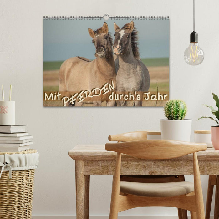 With horses through the year (CALVENDO wall calendar 2024) 